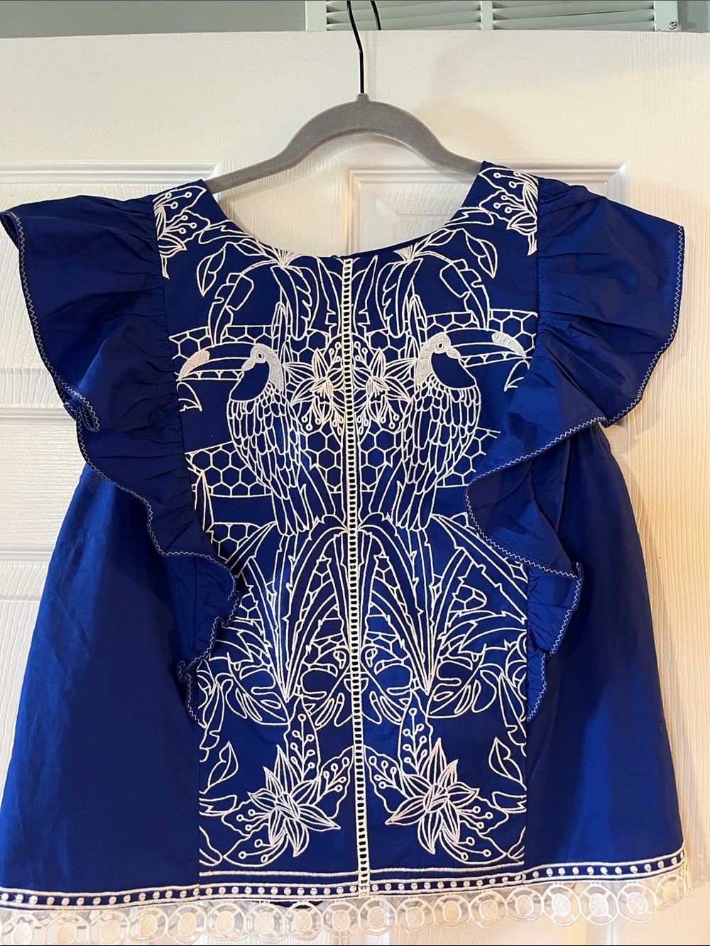 Anthropologie Royal Blue Flutter Sleeve Top with White Parrot Embroidery